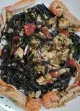 Immagine del passaggio 7 della ricetta Tagliatelle Gluten free nero di seppia al Sugo di Pesce