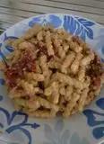 Immagine del passaggio 1 della ricetta Fusilli ai pomodorini secchi e noci