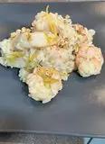 Immagine del passaggio 7 della ricetta Risotto gamberoni, fiori di zucchina e zeste di limone caramellate