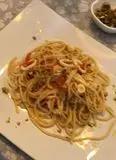 Immagine del passaggio 3 della ricetta Spaghetti calamari, peperoni e pistacchi