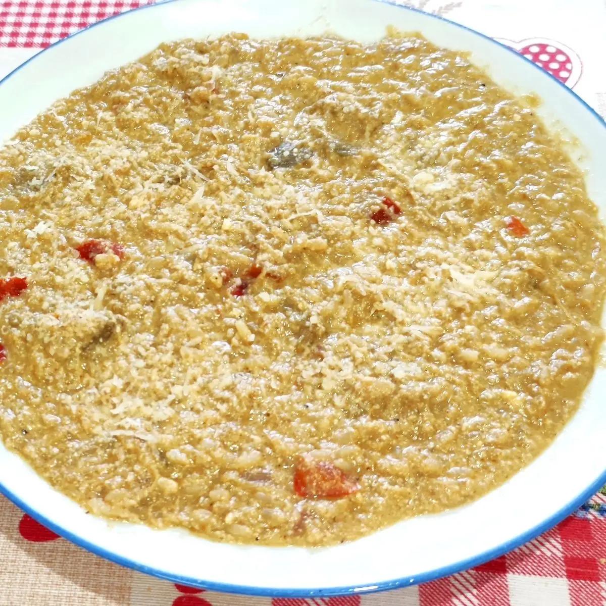 Ricetta Zuppa di riso  con crema di carciofi, peperoni e ricotta di ilninotto